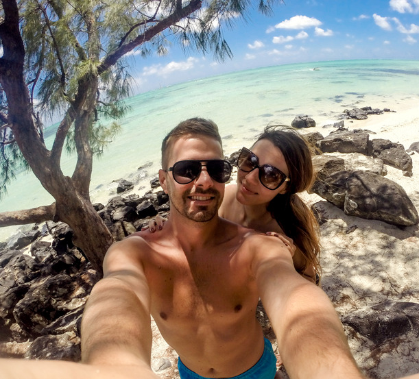 beautiful-young-couple-taking-beautiful-young-couple-taking-selfie-beach-enjoying-their-honeymoon-resized